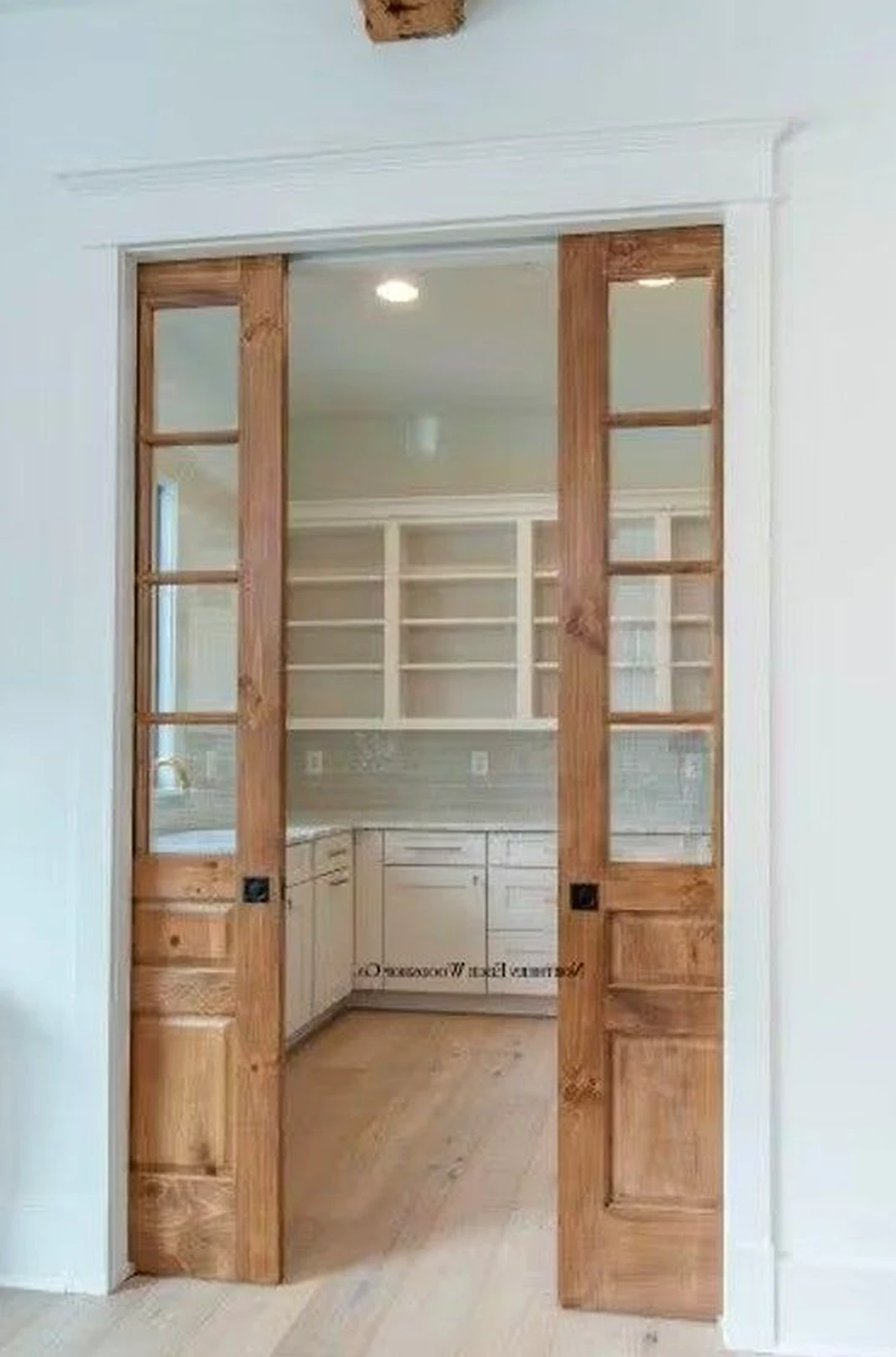 Luminous painted door supports the design through charm, leaving the space feeling easy to enjoy.