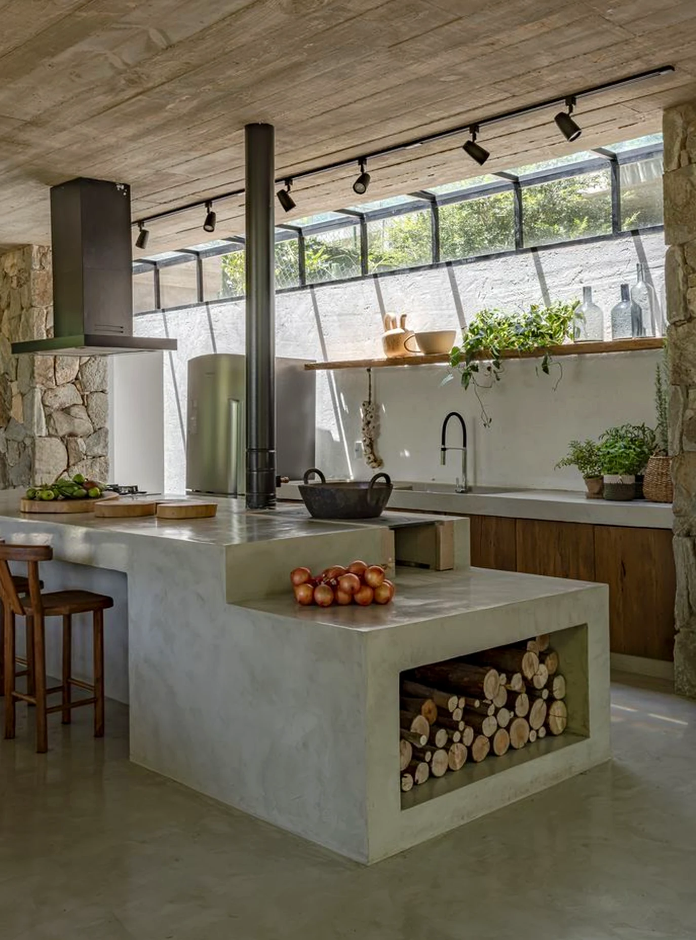 Refined fireplace area frames the outdoor space with order, making the scene feel quietly finished.