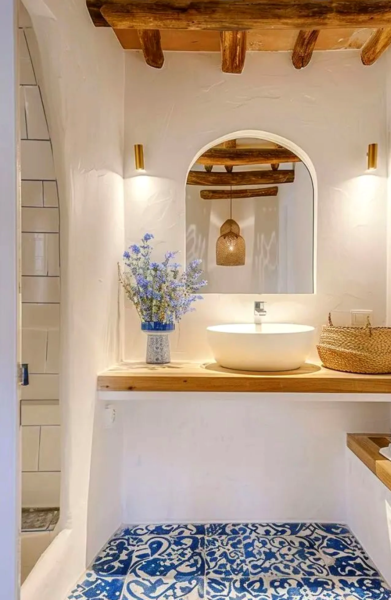 Layered decorative mirror gives the wall more softness, so the whole view feels quietly finished.