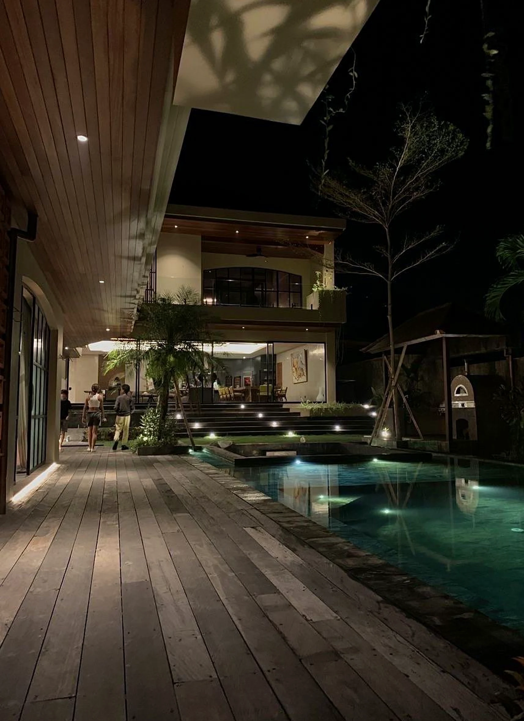 Elegant wooden deck supports the garden edge through ease, leaving the space feeling easy to enjoy.