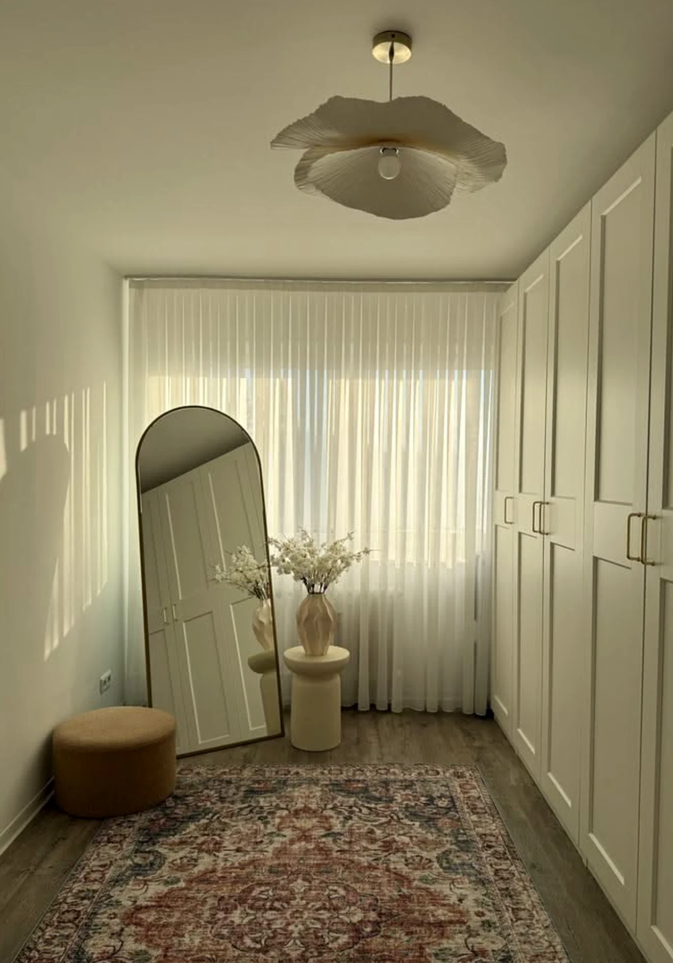 Leafy linen bedding brings warmth to the view, creating a mood that feels fresh and intentional.
